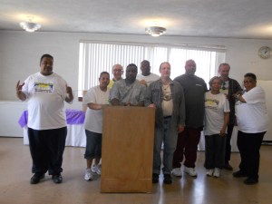 Scotty (to the right of the lectern) with the Morningside Community Executive Board. Note: Morningside does not endorse any candidates, and none is implied here.
